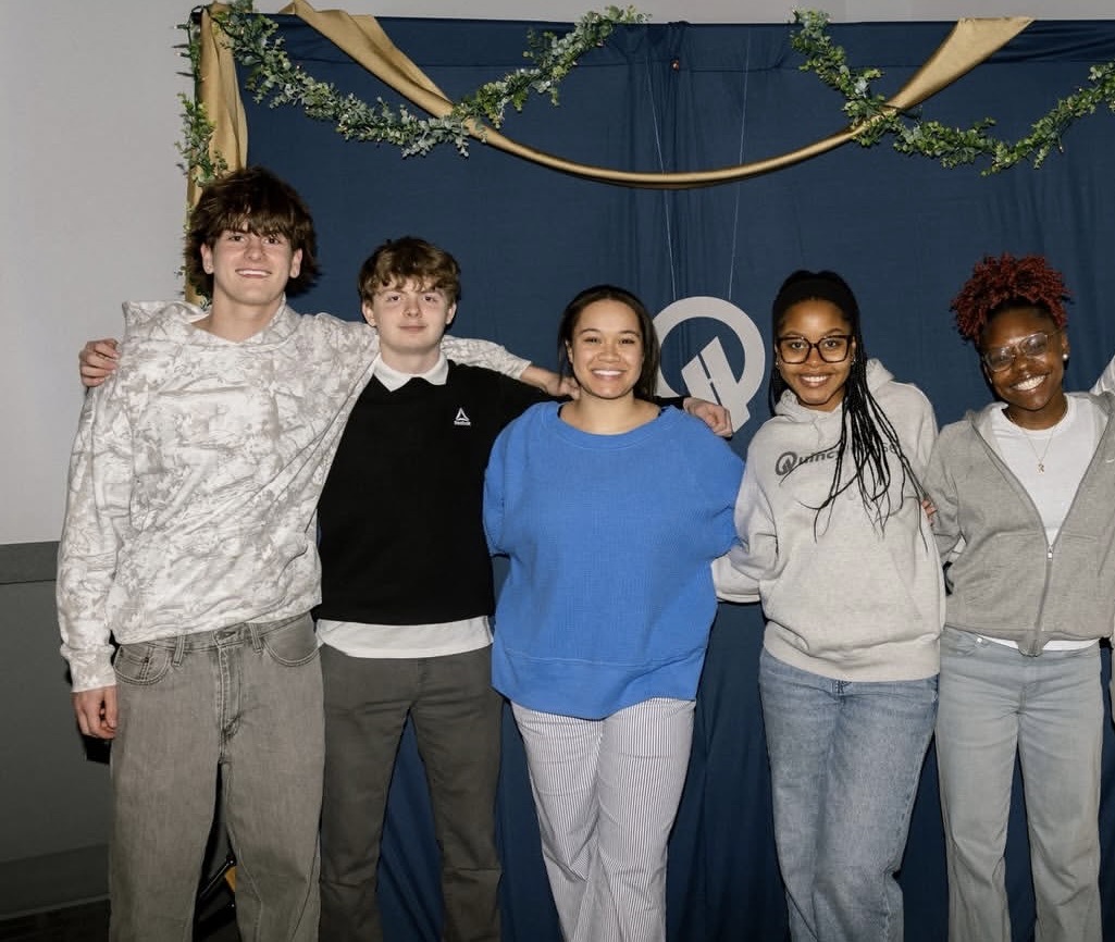 A group of teenagers smiling together
